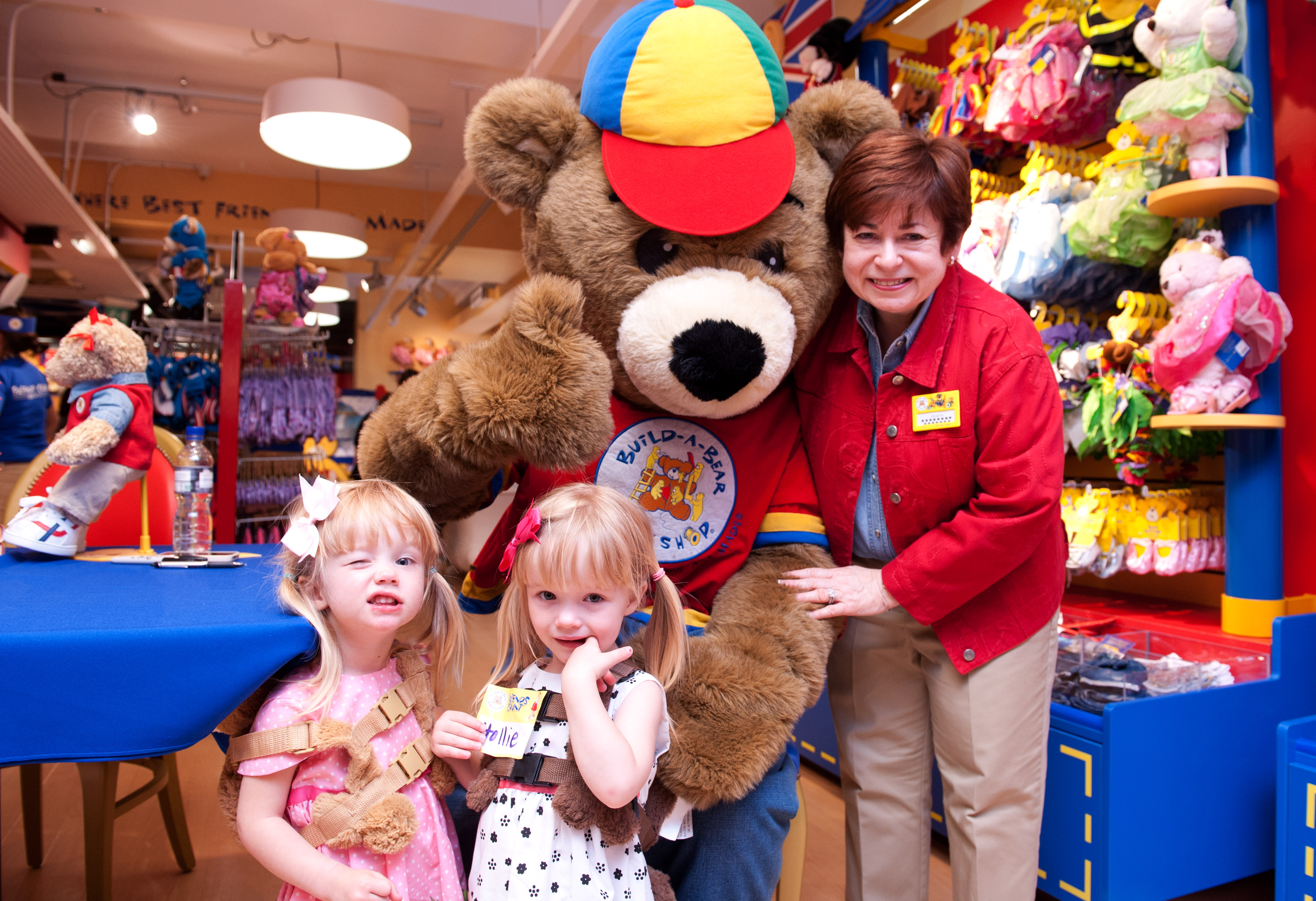 Build-A-Bear-Workshop-Grand-Re-Opening-Hamleys-Twins-Hollie-and-Ella-Hooper-2-years-6-months-meet-BABW-mascot-Bearemy-and-Founder-Maxine-Clark
